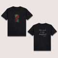 Basic T-Shirt Premium 100% COTTON 200 GSM 
Front and back view of a black streetwear tee. Front: 5x8 RGBY line art of praying hands with a cross, sun, and water elements in vibrant Red, Green, Blue, and Yellow. Back: 8x8 white text reading "The Lord Is my Shepherd" with "Psalm 23:1" below it. Only @ Tintahan-on-Thread